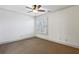 A spacious bedroom features neutral carpet, a window with shutters, base molding and white walls at 2765 Prado Ln, Marietta, GA 30066
