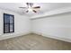 Bedroom with carpet, a ceiling fan, and a window with black shutters at 2765 Prado Ln, Marietta, GA 30066