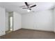 A spacious bedroom featuring neutral carpet, base molding, and a ceiling fan at 2765 Prado Ln, Marietta, GA 30066