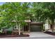 Two-story home with green siding, landscaping, and a two-car garage at 2765 Prado Ln, Marietta, GA 30066