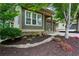 Home exterior with charming landscaping, stone accents, and a quaint front porch at 2765 Prado Ln, Marietta, GA 30066
