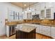 Well-lit kitchen features wooden ceiling, granite countertops, island, and stainless steel appliances at 2765 Prado Ln, Marietta, GA 30066