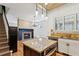 Living room displays a staircase, fireplace, wooden floors, and view of the kitchen island at 2765 Prado Ln, Marietta, GA 30066