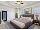 Spacious main bedroom with tray ceiling, plantation shutters, and en-suite bathroom at 2765 Prado Ln, Marietta, GA 30066