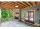 Covered patio features stone fireplace, flagstone flooring, wood ceiling and outdoor seating area at 2765 Prado Ln, Marietta, GA 30066