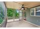 Screened-in back porch with ceiling fan and wooded view at 2765 Prado Ln, Marietta, GA 30066
