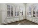 Bright sunroom with slate tile floor and lots of natural light streaming through white shuttered windows at 2765 Prado Ln, Marietta, GA 30066