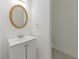 Clean bathroom with vanity, oval mirror and tiled floor at 5090 Leeshire Trce, Tucker, GA 30084