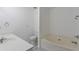 Well-lit bathroom featuring a soaking tub and modern fixtures at 5090 Leeshire Trce, Tucker, GA 30084