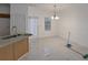 Open dining area with marble floors, and a modern light fixture at 5090 Leeshire Trce, Tucker, GA 30084
