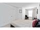 Bright bedroom with neutral decor, a double bed, a window, and minimalist artwork at 6315 Princeton Ridge Dr, Lithonia, GA 30058