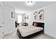 Comfortable bedroom featuring neutral walls, decorative floral artwork, and a cozy double bed at 6315 Princeton Ridge Dr, Lithonia, GA 30058