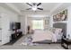 Spacious bedroom with tray ceilings, soft carpeting, and a comfortable queen-sized bed at 6315 Princeton Ridge Dr, Lithonia, GA 30058