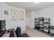 Home office area featuring a work desk, natural light, art, and sleek black shelves at 6315 Princeton Ridge Dr, Lithonia, GA 30058