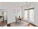 Charming dining area with table seating two, next to large mirror and exterior door at 6315 Princeton Ridge Dr, Lithonia, GA 30058