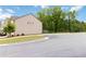 Exterior view of the home next to parking spots, offering both residential appeal and parking convenience at 6315 Princeton Ridge Dr, Lithonia, GA 30058