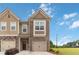 Charming two-story townhome with a brick and siding facade and a well-maintained lawn at 6315 Princeton Ridge Dr, Lithonia, GA 30058