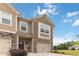 Well-maintained two-story townhome with attached garage and a welcoming front yard at 6315 Princeton Ridge Dr, Lithonia, GA 30058