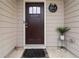 Inviting front door with decorative wreath and a 'Home' sign creating a warm entrance at 6315 Princeton Ridge Dr, Lithonia, GA 30058