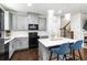 Stylish kitchen featuring grey cabinets and barstool seating at the island at 6315 Princeton Ridge Dr, Lithonia, GA 30058