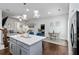 Open-concept kitchen flows into the living and dining areas, with a large island as a focal point at 6315 Princeton Ridge Dr, Lithonia, GA 30058