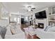 Open-concept living room with fireplace, hardwood floors, and modern decor at 6315 Princeton Ridge Dr, Lithonia, GA 30058