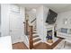 Living room with fireplace, hardwood floors, and a staircase leading to the upper level at 6315 Princeton Ridge Dr, Lithonia, GA 30058