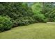 Lush backyard with perfectly manicured lawn and mature landscaping at 444 Rock Springs Ne Rd, Atlanta, GA 30324