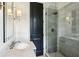 Modern bathroom features a glass shower, marble vanity, and dark accents at 444 Rock Springs Ne Rd, Atlanta, GA 30324