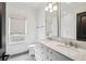 Bathroom features a double vanity with marble countertop and modern fixtures at 444 Rock Springs Ne Rd, Atlanta, GA 30324