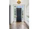 Welcoming foyer with dark wood herringbone floors, a black front door, and a decorative gold light fixture at 444 Rock Springs Ne Rd, Atlanta, GA 30324