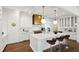 Bright kitchen with white cabinets, marble countertops, island seating, and modern stainless steel appliances at 444 Rock Springs Ne Rd, Atlanta, GA 30324