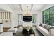 Open-concept living space with modern furnishings and an adjacent kitchen, perfect for entertaining guests at 444 Rock Springs Ne Rd, Atlanta, GA 30324