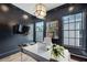This modern office features a sleek desk, statement lighting, and natural light at 444 Rock Springs Ne Rd, Atlanta, GA 30324
