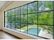 Stunning backyard view through expansive windows, showcasing a serene pool and lush landscaping at 444 Rock Springs Ne Rd, Atlanta, GA 30324