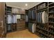 Organized walk-in closet features shelving for shoes, clothes, and accessories at 444 Rock Springs Ne Rd, Atlanta, GA 30324