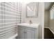 This bathroom has a vanity with a sink and a shower with a curtain at 4935 Golden Sw Cir, Mableton, GA 30126