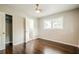 This bedroom has hardwood floors and an ensuite bathroom at 4935 Golden Sw Cir, Mableton, GA 30126