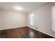 Bedroom with hardwood floors and bright light from the window at 4935 Golden Sw Cir, Mableton, GA 30126