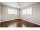 This bedroom has hardwood floors and two windows at 4935 Golden Sw Cir, Mableton, GA 30126