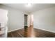 This bedroom has hardwood floors, a walk-in closet, and a bathroom at 4935 Golden Sw Cir, Mableton, GA 30126