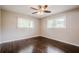 This bedroom has hardwood floors and two windows at 4935 Golden Sw Cir, Mableton, GA 30126