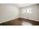 This bedroom has hardwood floors and a window at 4935 Golden Sw Cir, Mableton, GA 30126