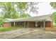 Ranch-style home featuring a covered carport, and a quaint front porch at 4935 Golden Sw Cir, Mableton, GA 30126