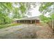 View of the ranch-style home with attached covered carport and driveway at 4935 Golden Sw Cir, Mableton, GA 30126