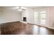 Bright living room featuring a painted brick fireplace and French doors at 4935 Golden Sw Cir, Mableton, GA 30126