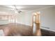 Open-concept living room with hardwood floors flows into the adjacent kitchen at 4935 Golden Sw Cir, Mableton, GA 30126