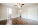 This spacious main bedroom features hardwood floors with an ensuite bathroom at 4935 Golden Sw Cir, Mableton, GA 30126