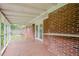 Covered porch featuring exposed brick and outdoor lighting at 4935 Golden Sw Cir, Mableton, GA 30126