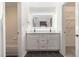 Stylish bathroom featuring double vanity and updated lighting at 502 Brighton Pt, Atlanta, GA 30328